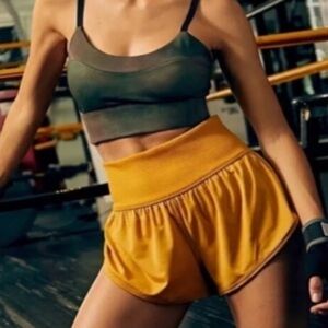 Free people movement Gametime in Shorts Mustard yellow